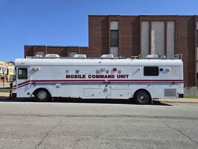 A mobile command unit vehicle parked on a street.