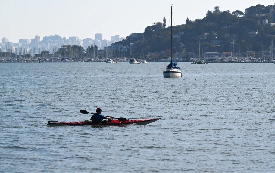 A kayaker paddles across Richardson Bay near Tiburon on Tuesday, Nov. 28, 2023. (Alan Dep/Marin Independent Journal)