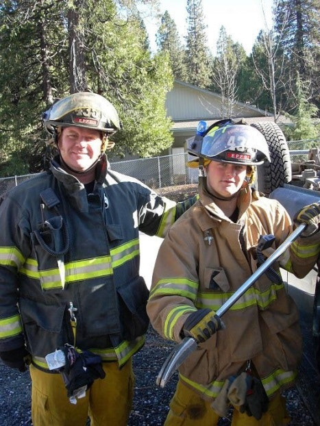 May contain: clothing, glove, helmet, person, and fireman