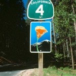May contain: sign, symbol, and road sign