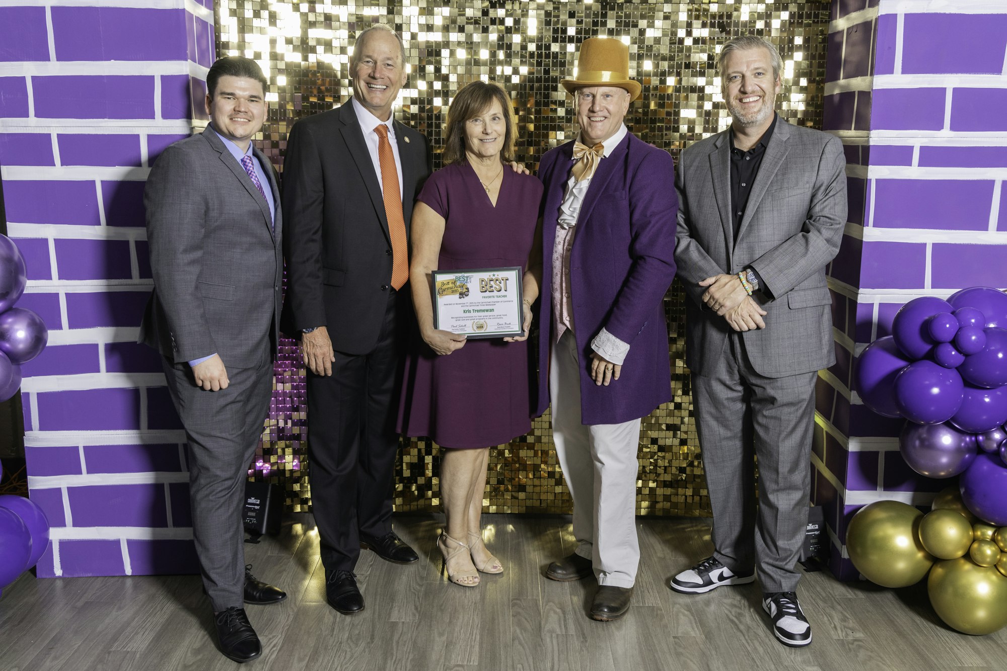 May contain: groupshot, person, purple, accessories, formal wear, tie, adult, female, woman, clothing, footwear, shoe, male, man, high heel, people, hat, jewelry, and necklace