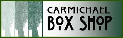 Text "Carmichael Box Shop" with tree silhouettes on the left side.