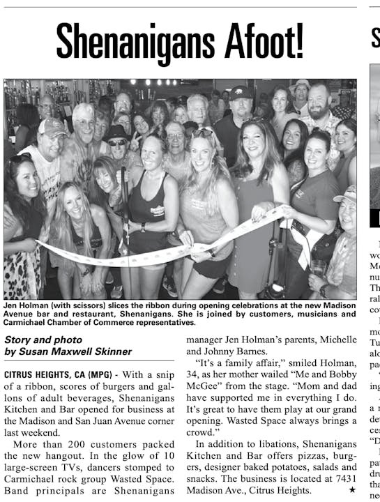 Group celebrating ribbon cutting at Shenanigans Kitchen and Bar opening in Citrus Heights, CA.