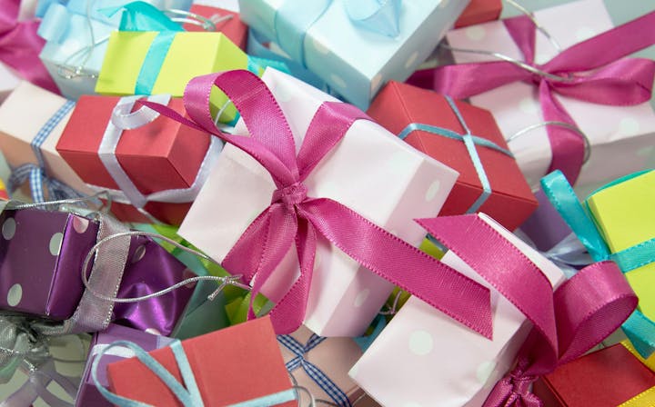 Colorful gift boxes with ribbons stacked together.