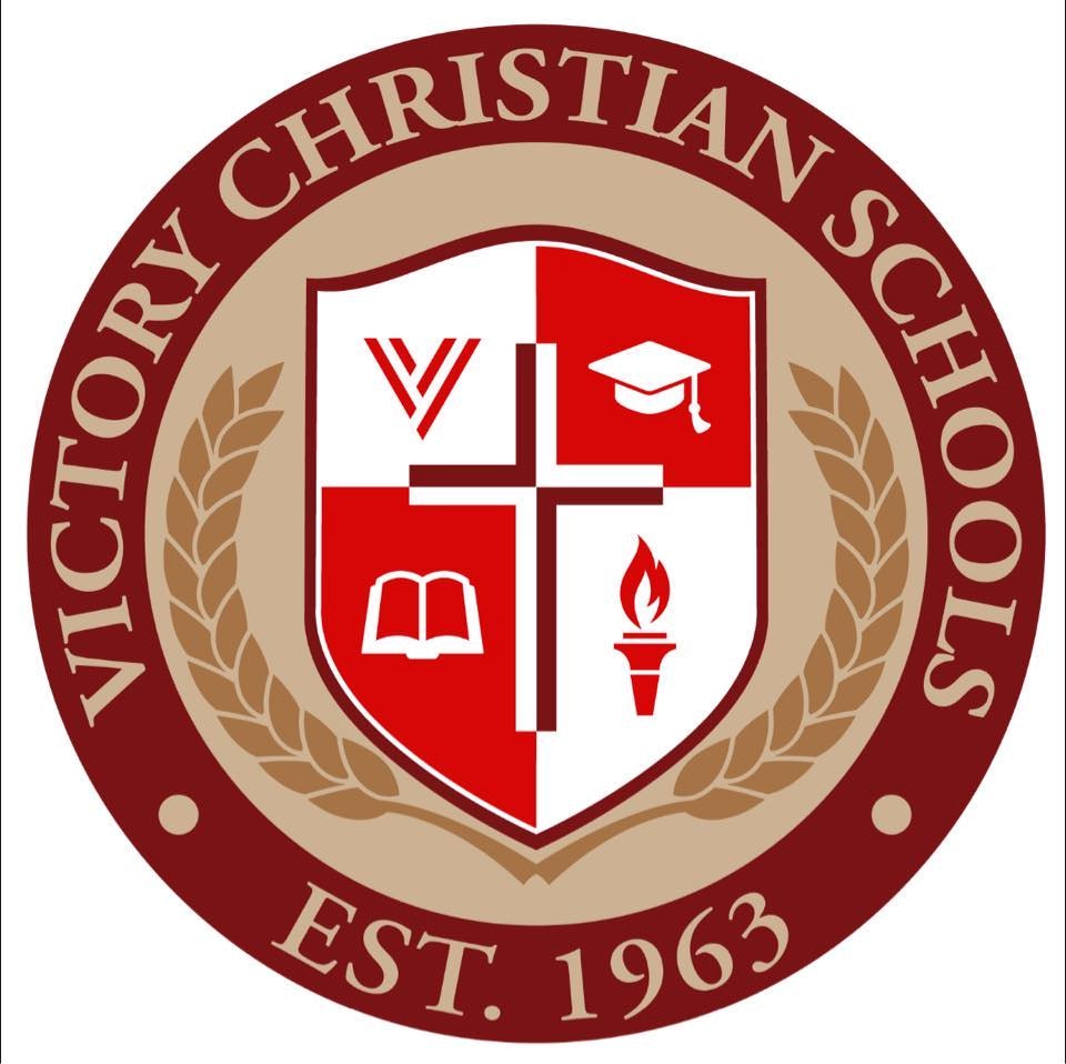 Victory Christian Schools seal with a cross, book, torch, and graduation cap, established 1963.