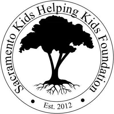The image features a logo for the Sacramento Kids Helping Kids Foundation, established in 2012, with a tree graphic.