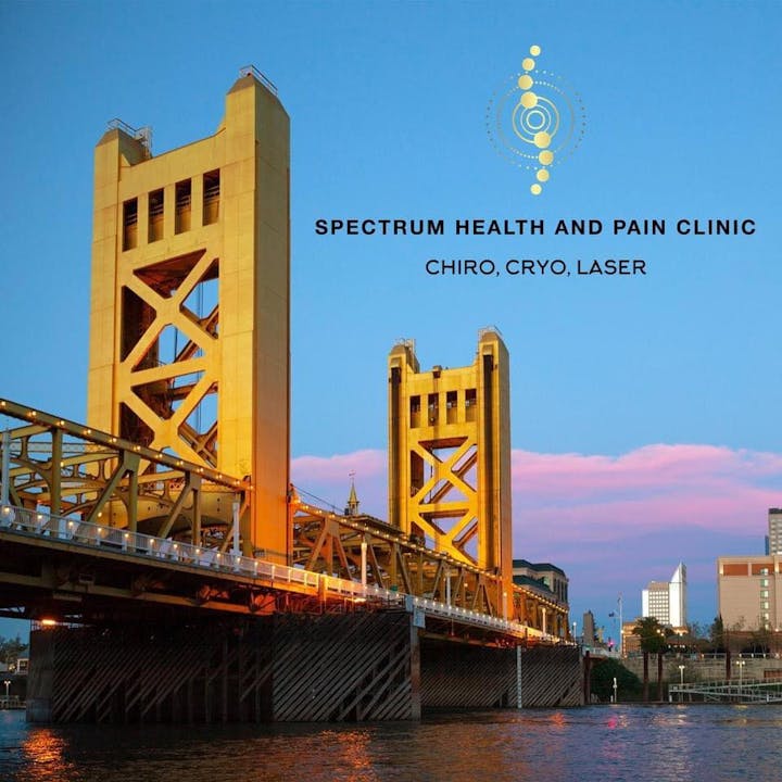 A bridge with "Spectrum Health and Pain Clinic: Chiro, Cryo, Laser" logo and text.