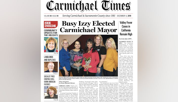 Front page of Carmichael Times featuring "Busy Izzy Elected Carmichael Mayor," with image of Izzy Delancey and community news.