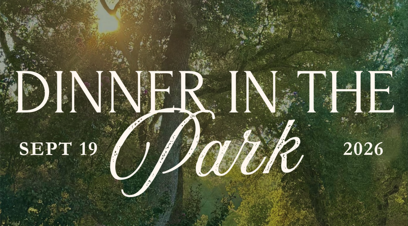 The image features a promotional text for "Dinner in the Park" scheduled for September 19, 2026, surrounded by greenery.