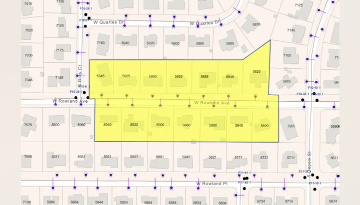 The image shows a map section highlighting buildings along W Rowland Ave and W Quarles Dr, with addresses marked in yellow.