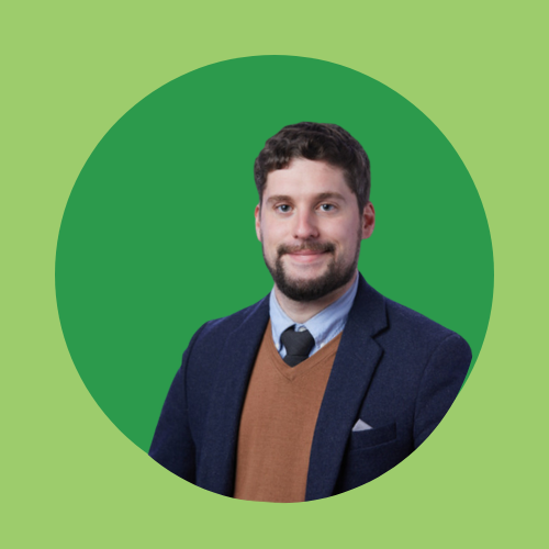 A man in formal attire with a green circular background.