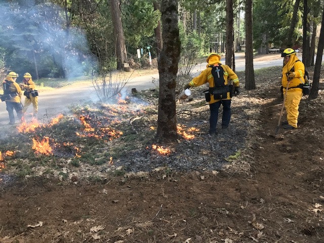May contain: person, human, and fire