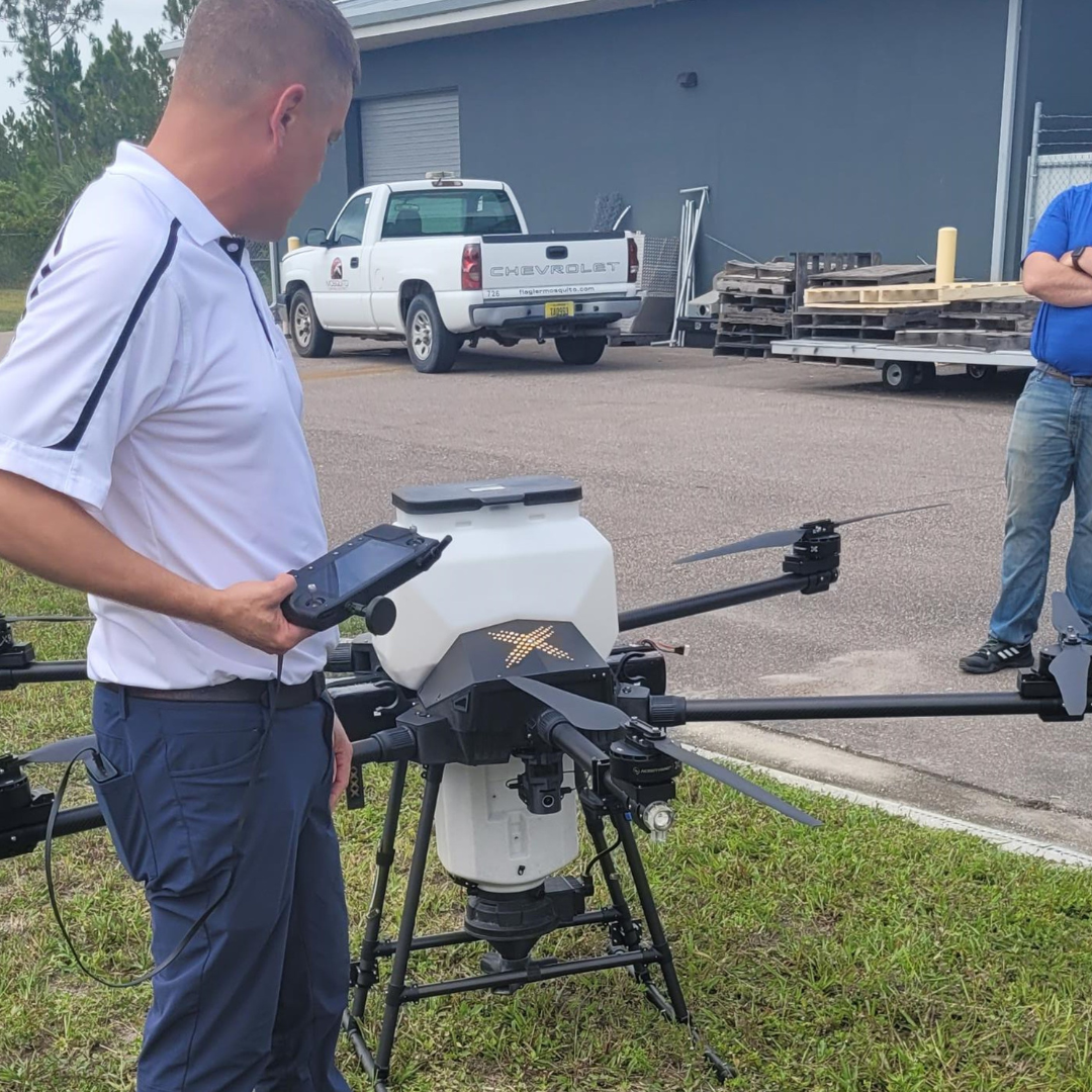 Men working with a drone during training