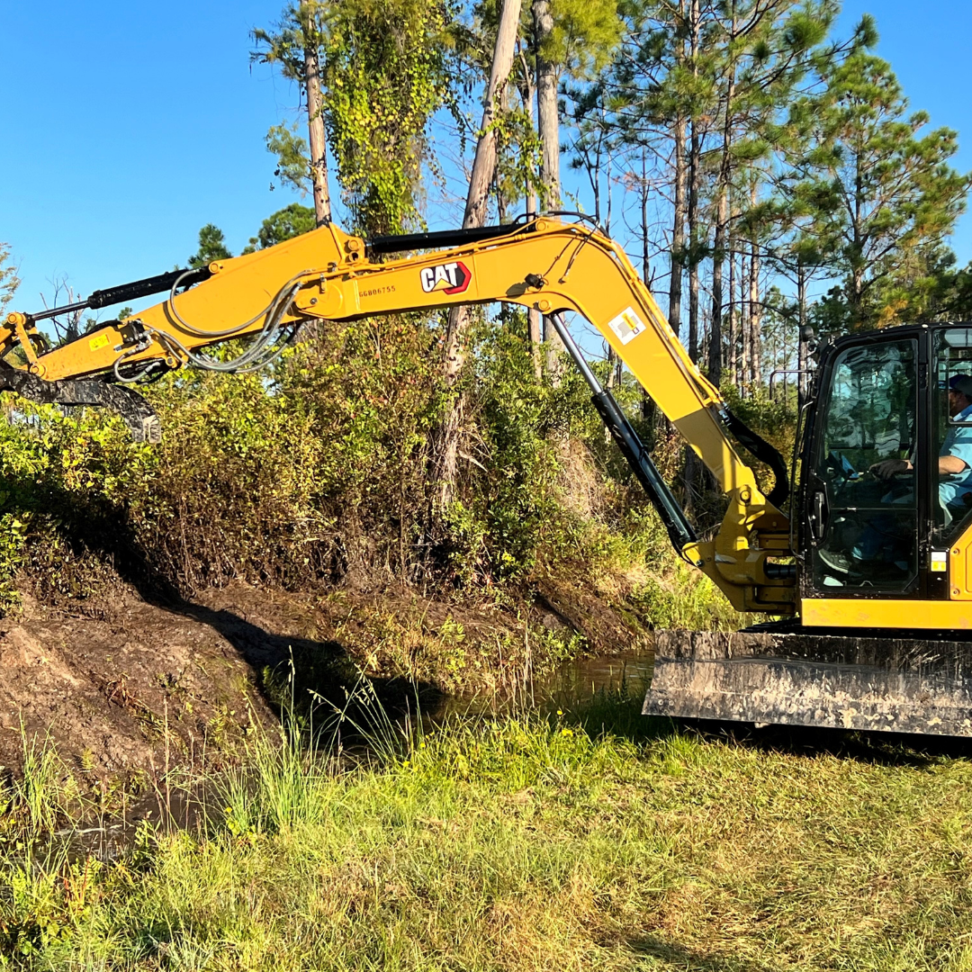 Bulldozer being used to maintain mosquito ditch
