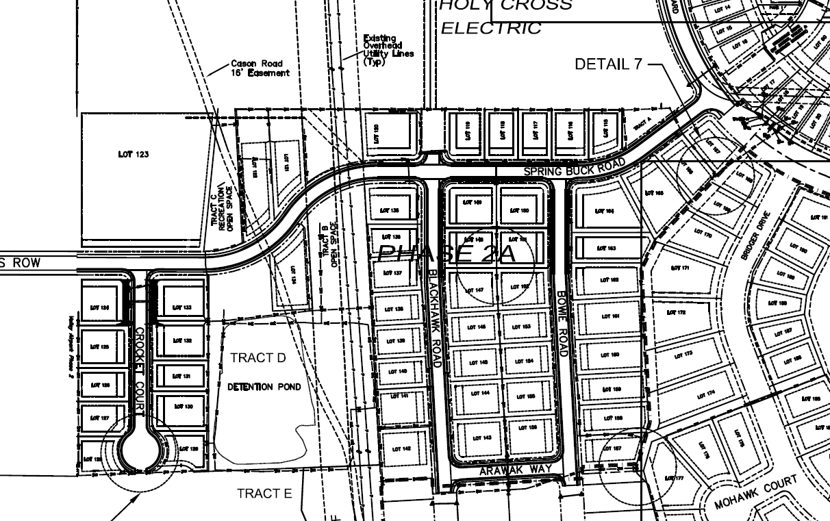 A detailed subdivision map showing lot divisions, roads, and a detention pond.