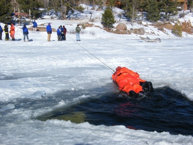 May contain: clothing, vest, lifejacket, person, and glove
