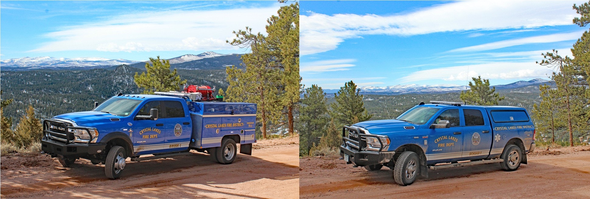 Two blue Crystal Lakes Fire Dept. trucks parked on a dirt road with a scenic mountain background.