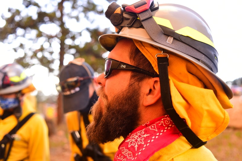 May contain: clothing, hardhat, helmet, head, person, face, beard, adult, male, man, accessories, sunglasses, and worker