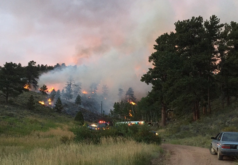 May contain: car, transportation, vehicle, fire, and forest fire
