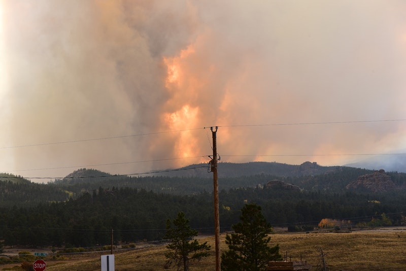May contain: utility pole and fire