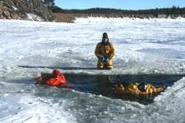 May contain: clothing, lifejacket, vest, transportation, vehicle, watercraft, adult, female, person, woman, coat, ice, outdoors, and nature