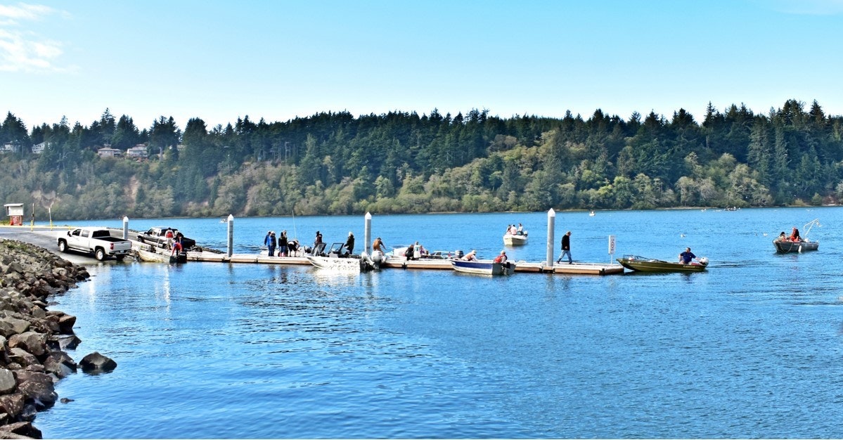 May contain: water, waterfront, nature, outdoors, scenery, port, boat, transportation, vehicle, pickup truck, truck, person, pier, and lake