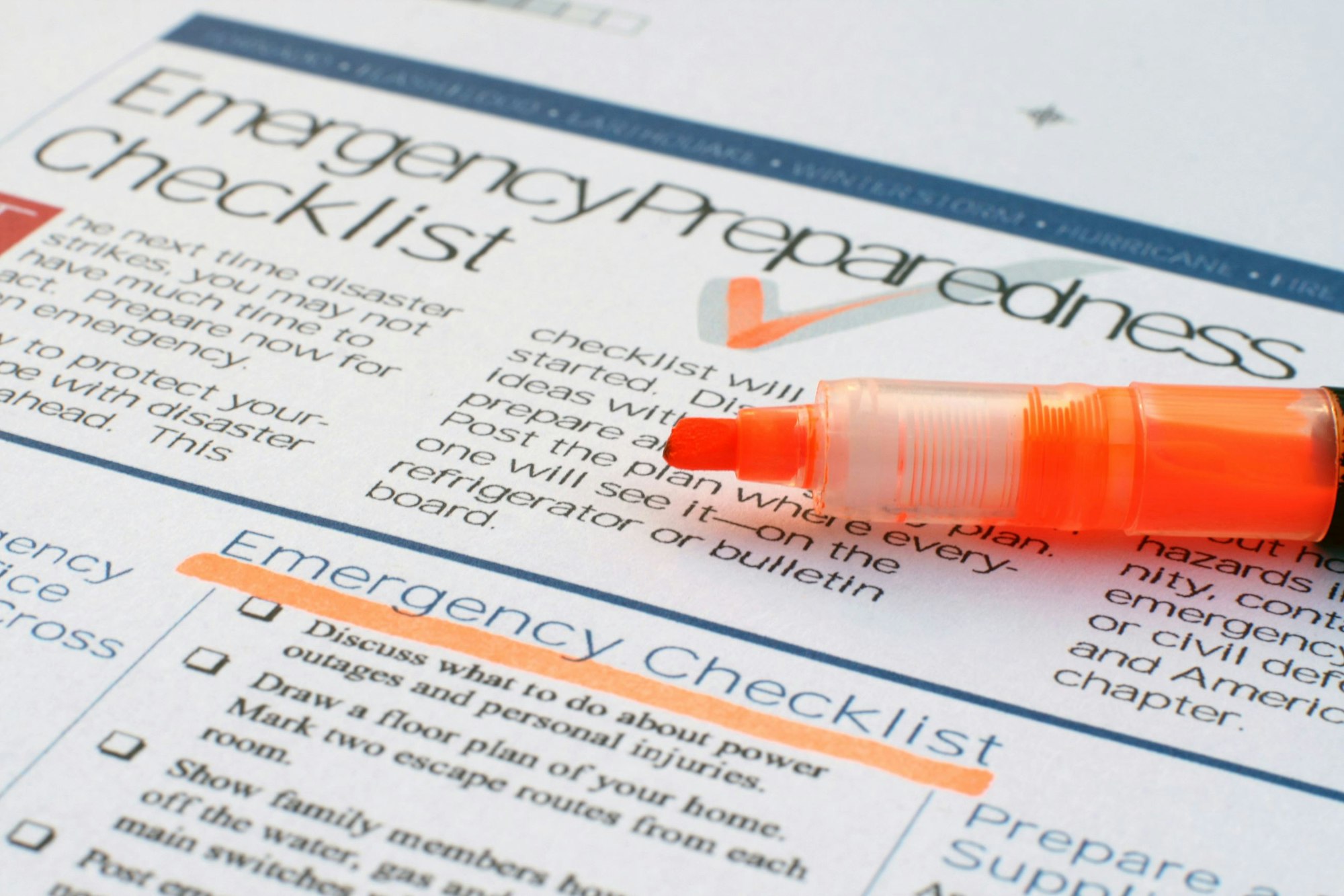 Emergency Preparedness Checklist with an orange highlighter on top.