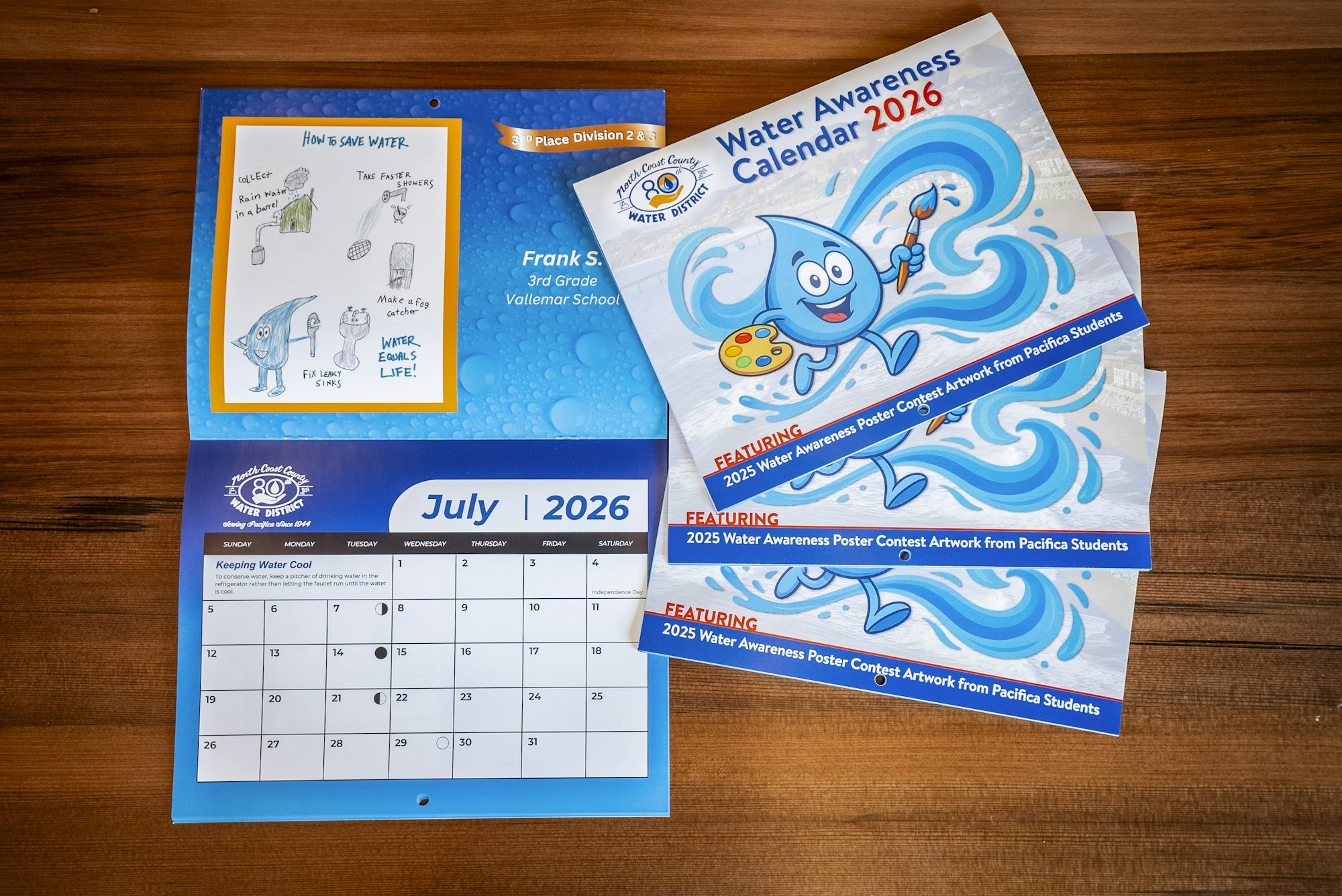 The image features a water awareness calendar for 2026, including student artwork and tips for saving water.
