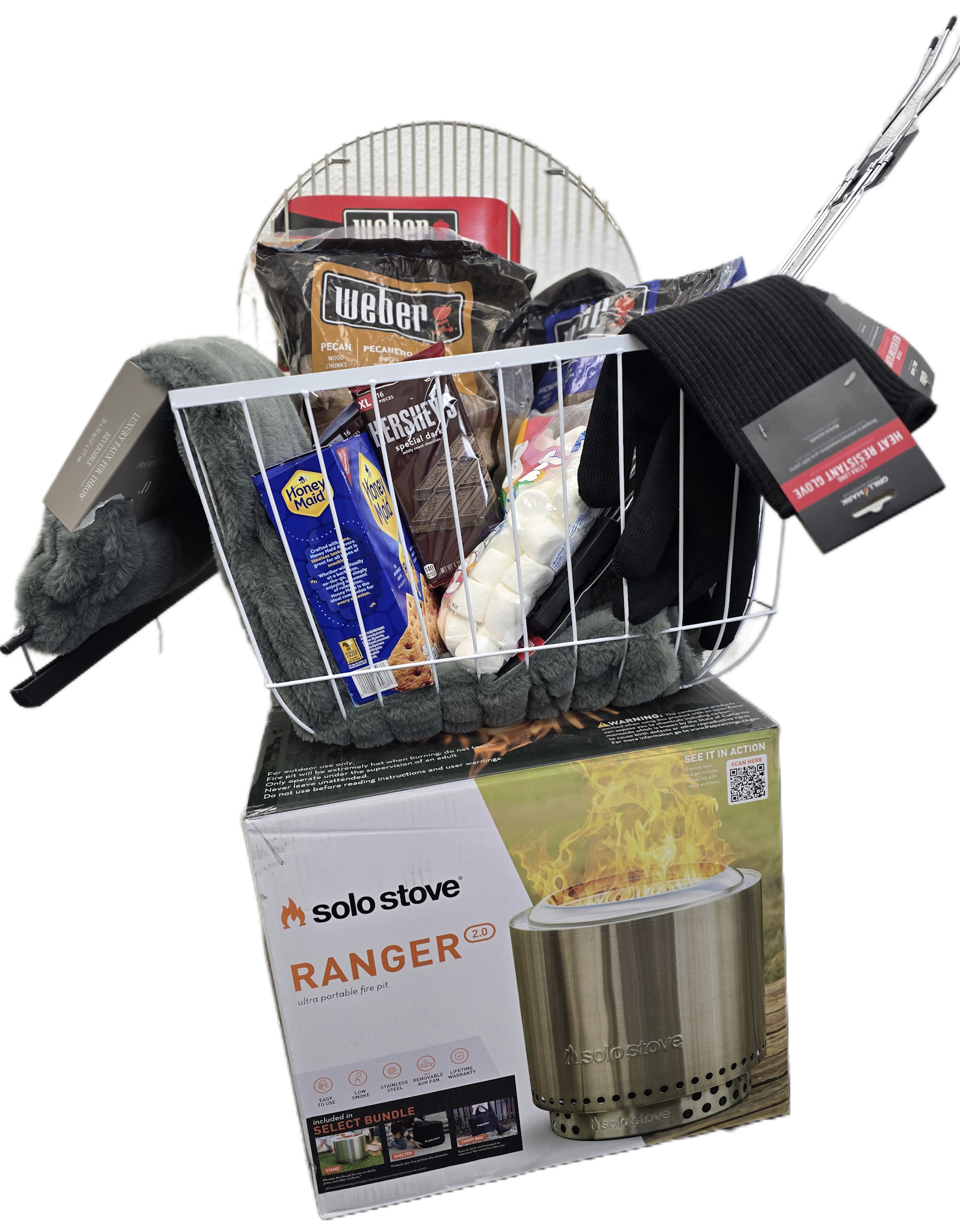 A shopping basket with a Solo Stove fire pit, s'mores ingredients, gloves, and grilling supplies. Perfect for a cozy night!