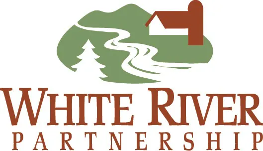 The image is a logo for "White River Partnership," featuring a river, a tree, and a house within a green landscape.