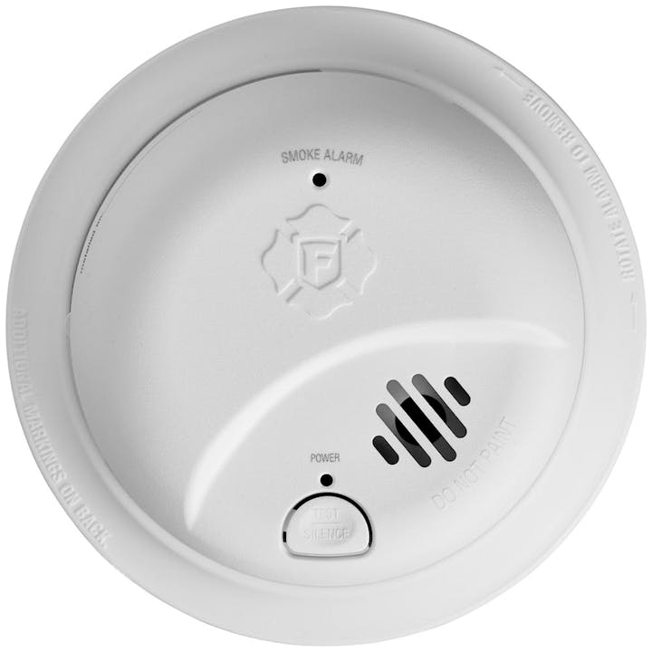 A round white smoke alarm with a test/silence button and ventilation slots.