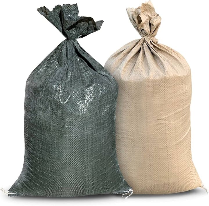 Two tied sacks, one dark gray and the other beige, standing upright.