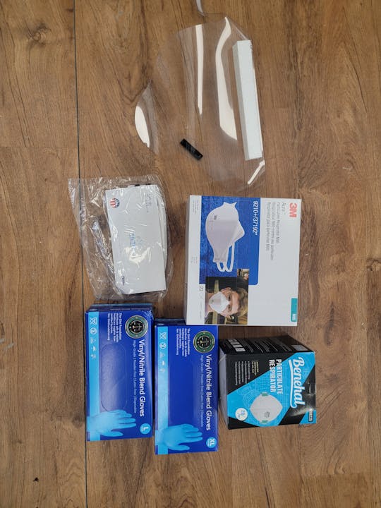 Protective gear: face shield, N95 masks, Benhal respirator, vinyl/nitrile gloves (two sizes).