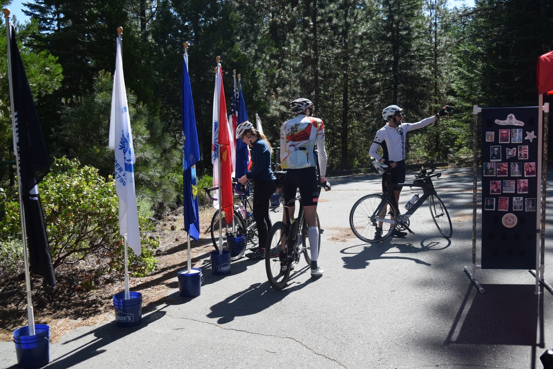 May contain: bicycle, bike, vehicle, transportation, wheel, machine, person, human, flag, and symbol