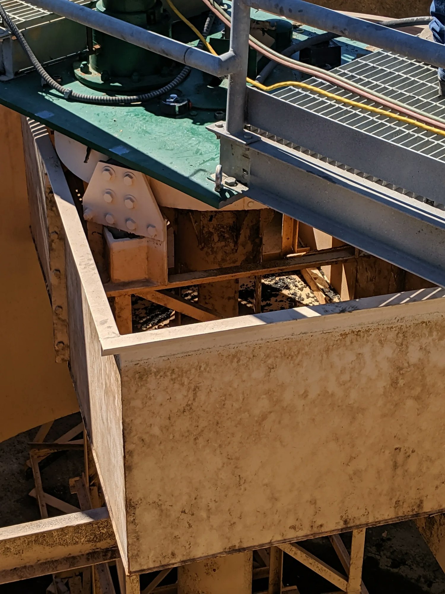 Industrial equipment with metal structures, possibly part of a machine or conveyor system.