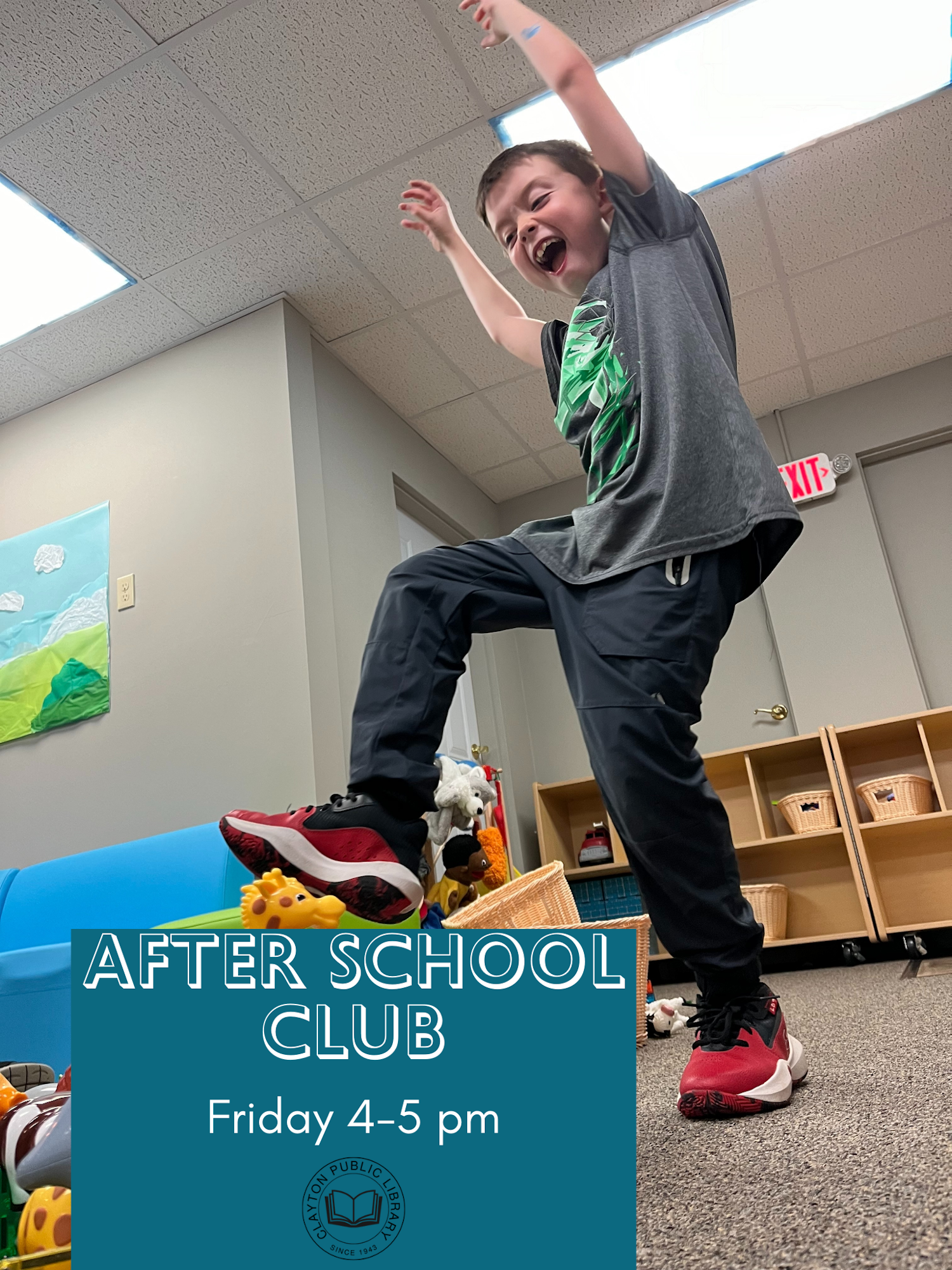 A child jumping excitedly at an after-school club event at a library.