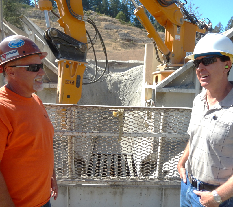 May contain: clothing, hardhat, helmet, accessories, sunglasses, adult, male, man, person, worker, construction, jeans, pants, face, and head
