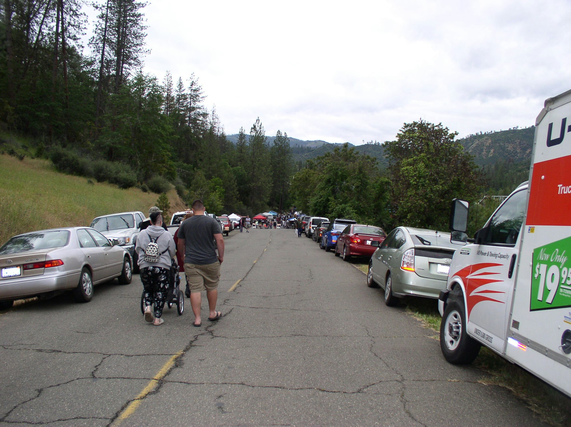 May contain: person, human, car, automobile, vehicle, transportation, parking lot, parking, wheel, machine, bicycle, and bike