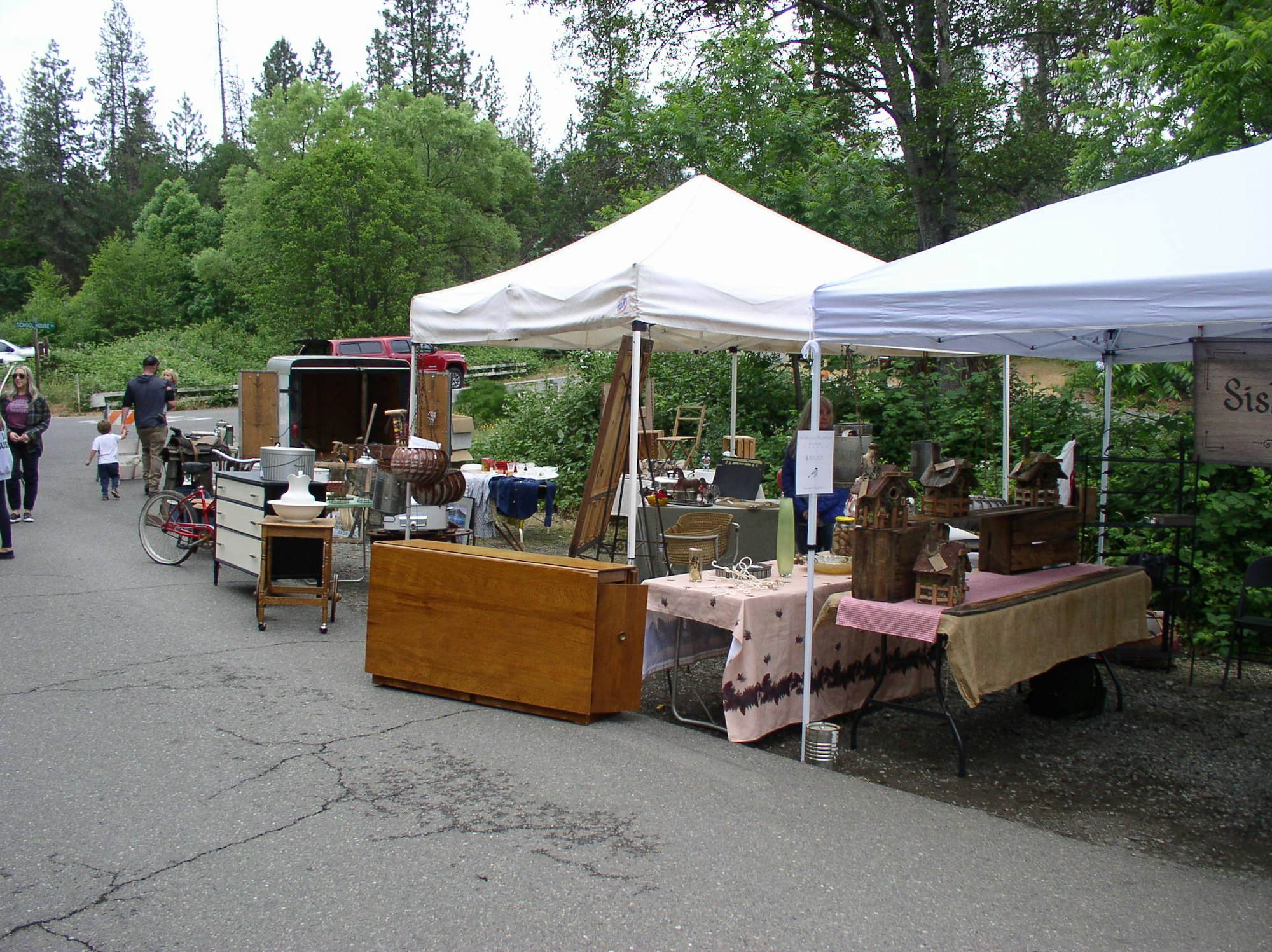 May contain: person, human, wood, tent, and plywood