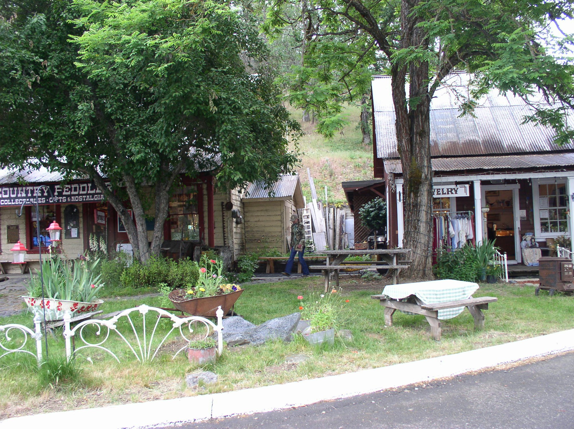 May contain: bench, furniture, outdoors, arbour, garden, patio, porch, and flagstone