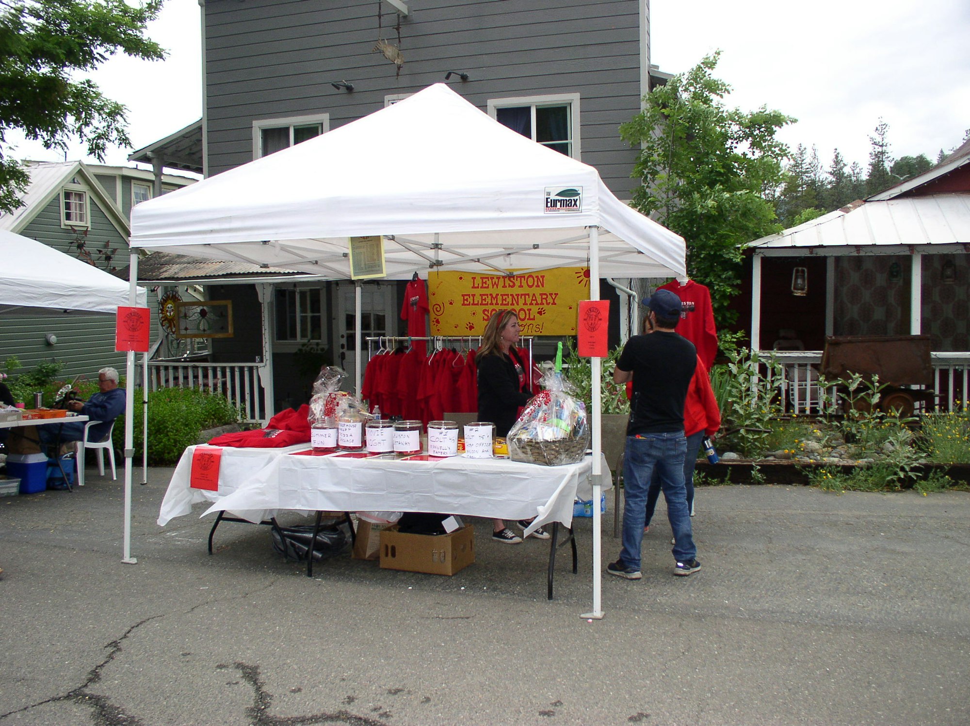 May contain: person, human, tent, and kiosk