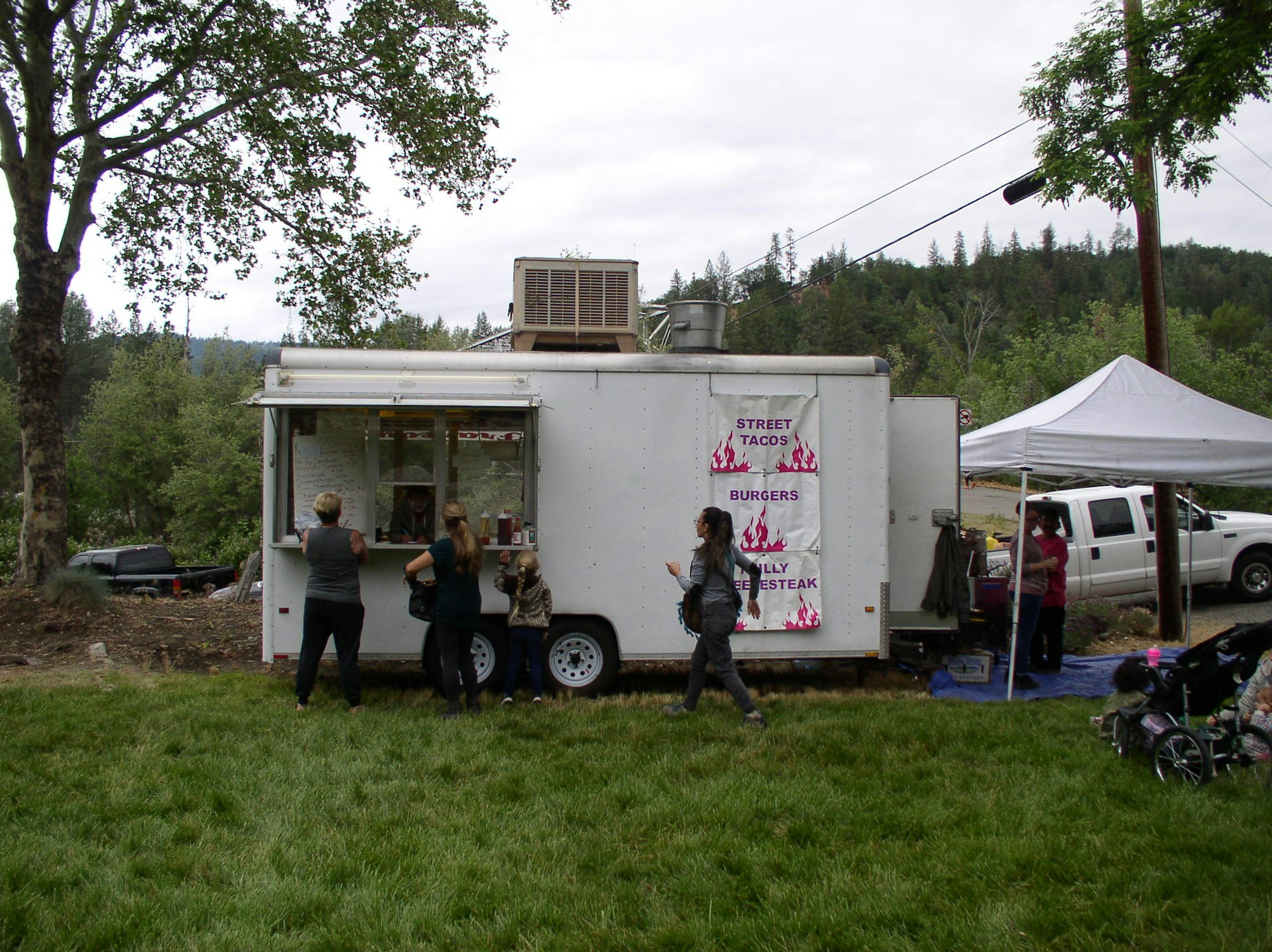May contain: person, human, truck, transportation, vehicle, and kiosk