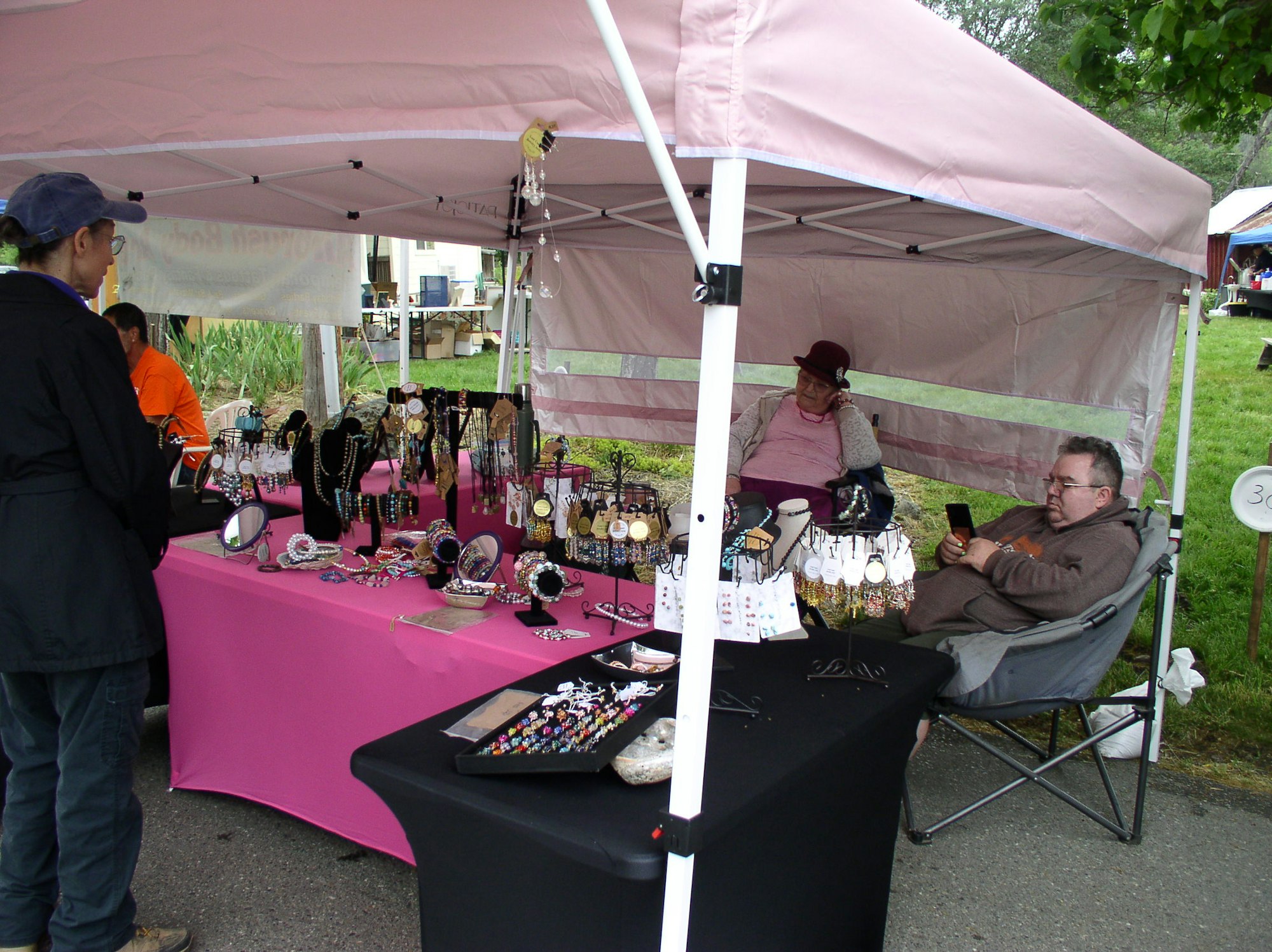 May contain: person, human, tent, shoe, clothing, footwear, and apparel