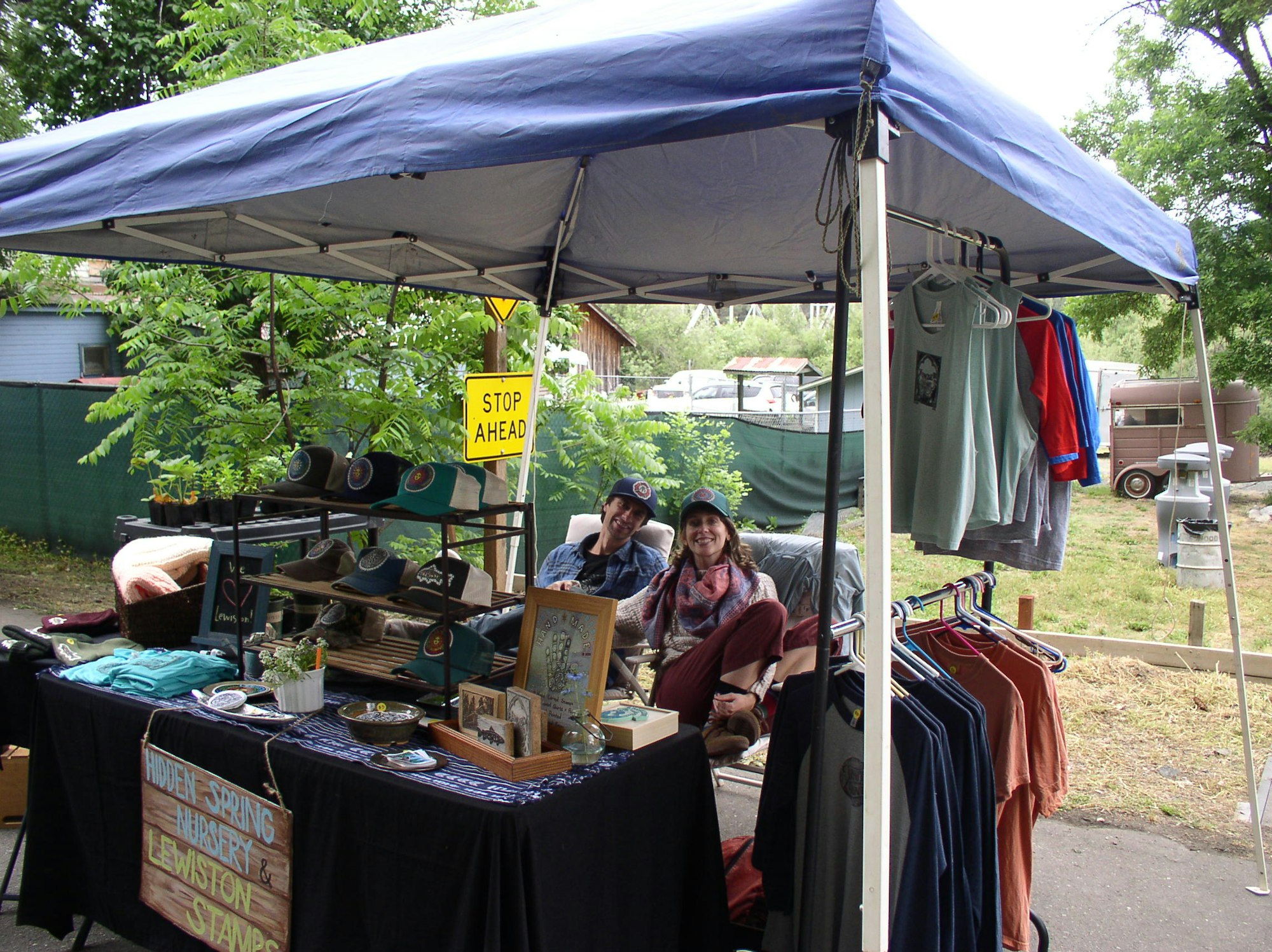 May contain: person, human, tent, market, bazaar, and shop