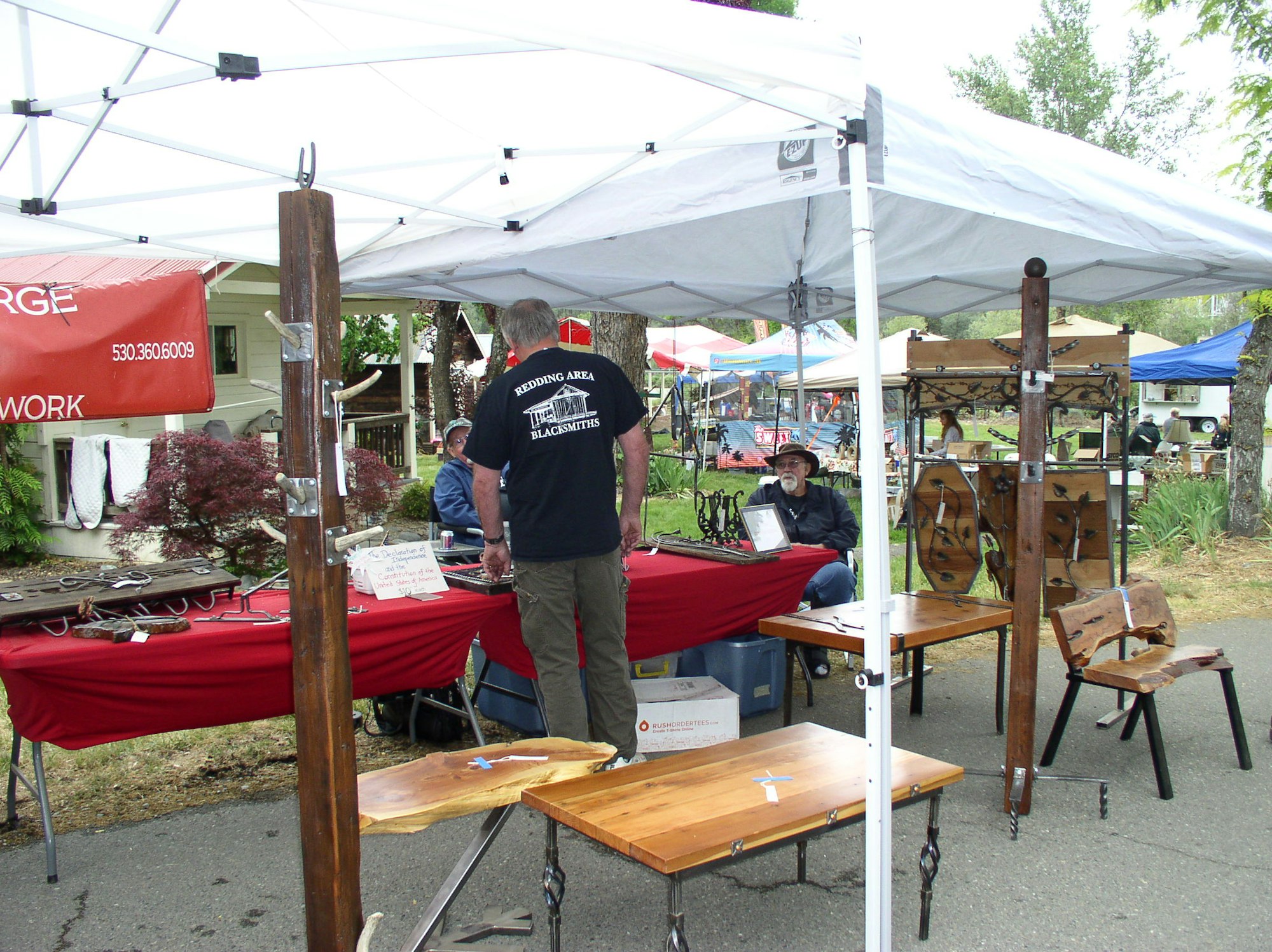May contain: wood, plywood, person, human, and tent