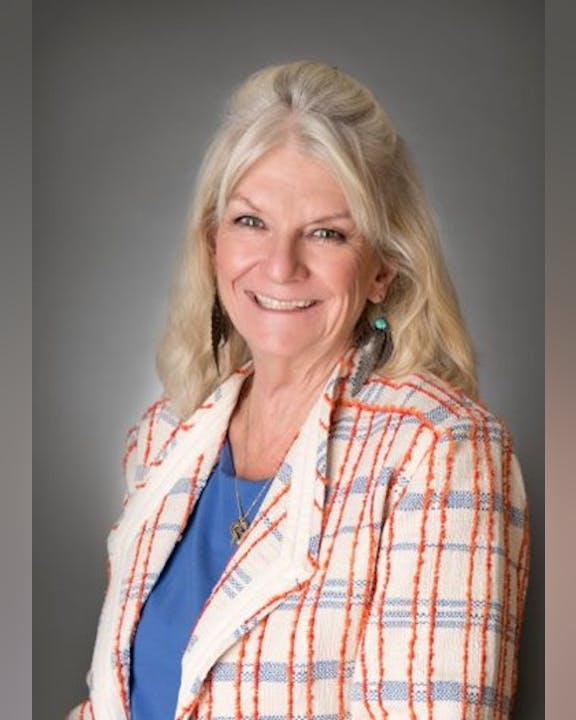 May contain: blonde, hair, person, face, head, photography, portrait, happy, smile, clothing, coat, adult, female, woman, accessories, jewelry, necklace, earring, and blouse