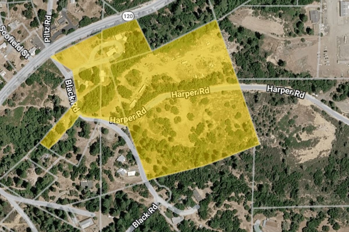 The image shows a map section highlighting areas around Black Rd and Harper Rd with yellow shading.