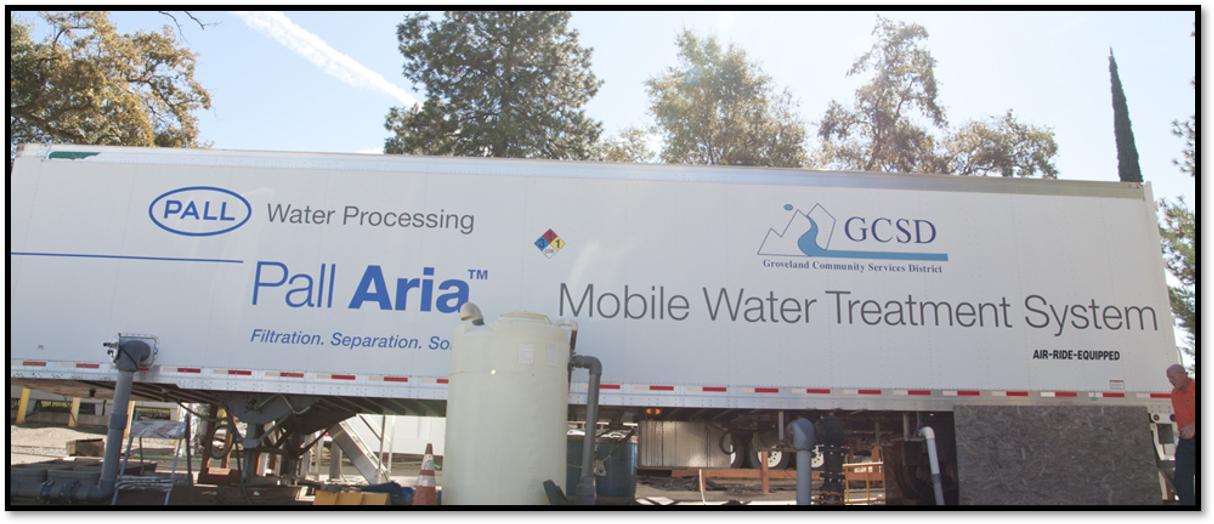 Mobile water treatment system truck labeled "Pall Aria" by Groveland Community Services District.