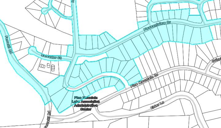 The image shows a map layout of a neighborhood called Pine Mountain, highlighting streets and an administrative center.