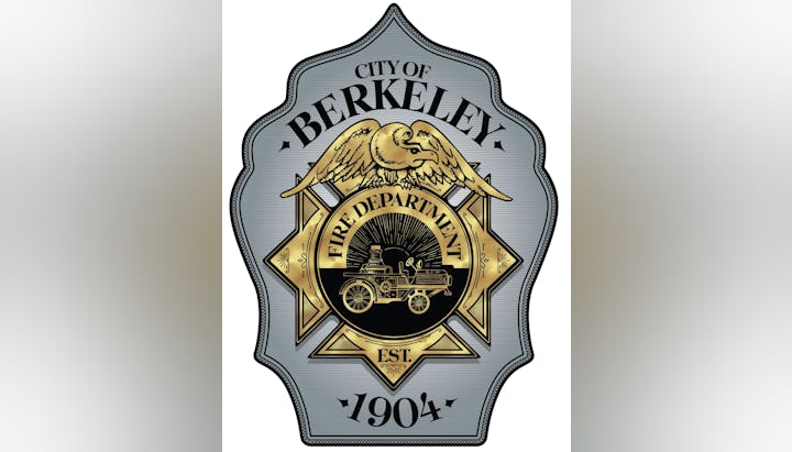 A badge with an eagle, vintage fire engine, and text: "City of Berkeley Fire Department Est. 1904."